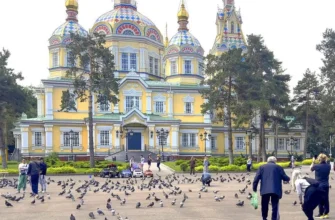 Zenkov Cathedral with colorful wooden domes and intricate carved details in Panfilov Park, Almaty