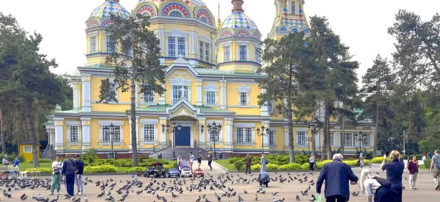 Zenkov Cathedral with colorful wooden domes and intricate carved details in Panfilov Park, Almaty